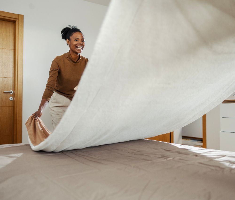 A person evaluating a mattress, checking for comfort and support